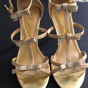 Strapped heels with crystal bows